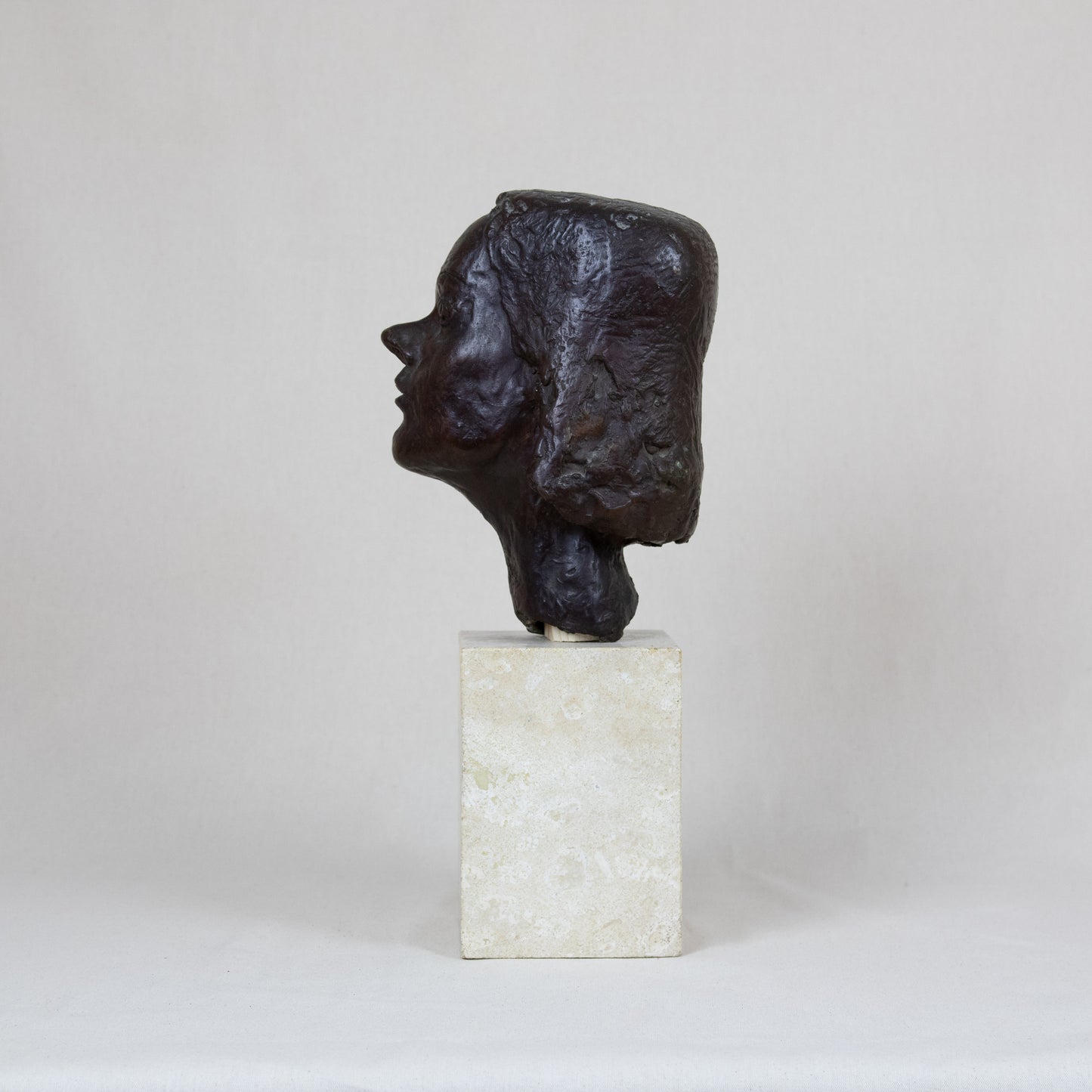 A modern bronze bust of a girl set atop a marble base, allegedly by Vincent Apap (1909 – 15 February 2003)*