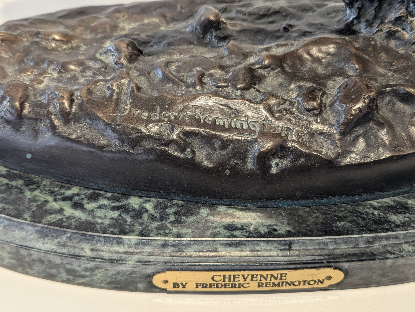 A briliant large bronze statue of a Native American (Cheyenne Tribe) warrior on horseback, marble base, signed