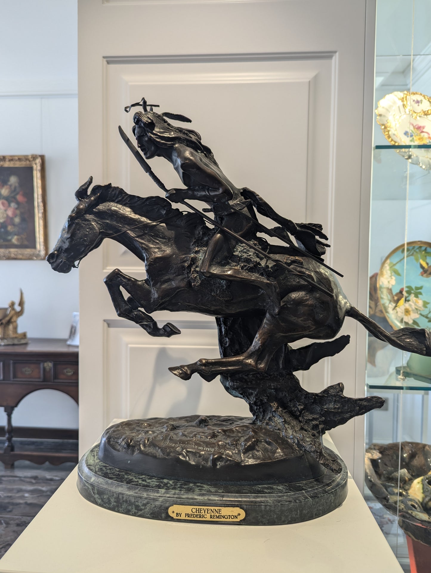 A briliant large bronze statue of a Native American (Cheyenne Tribe) warrior on horseback, marble base, signed