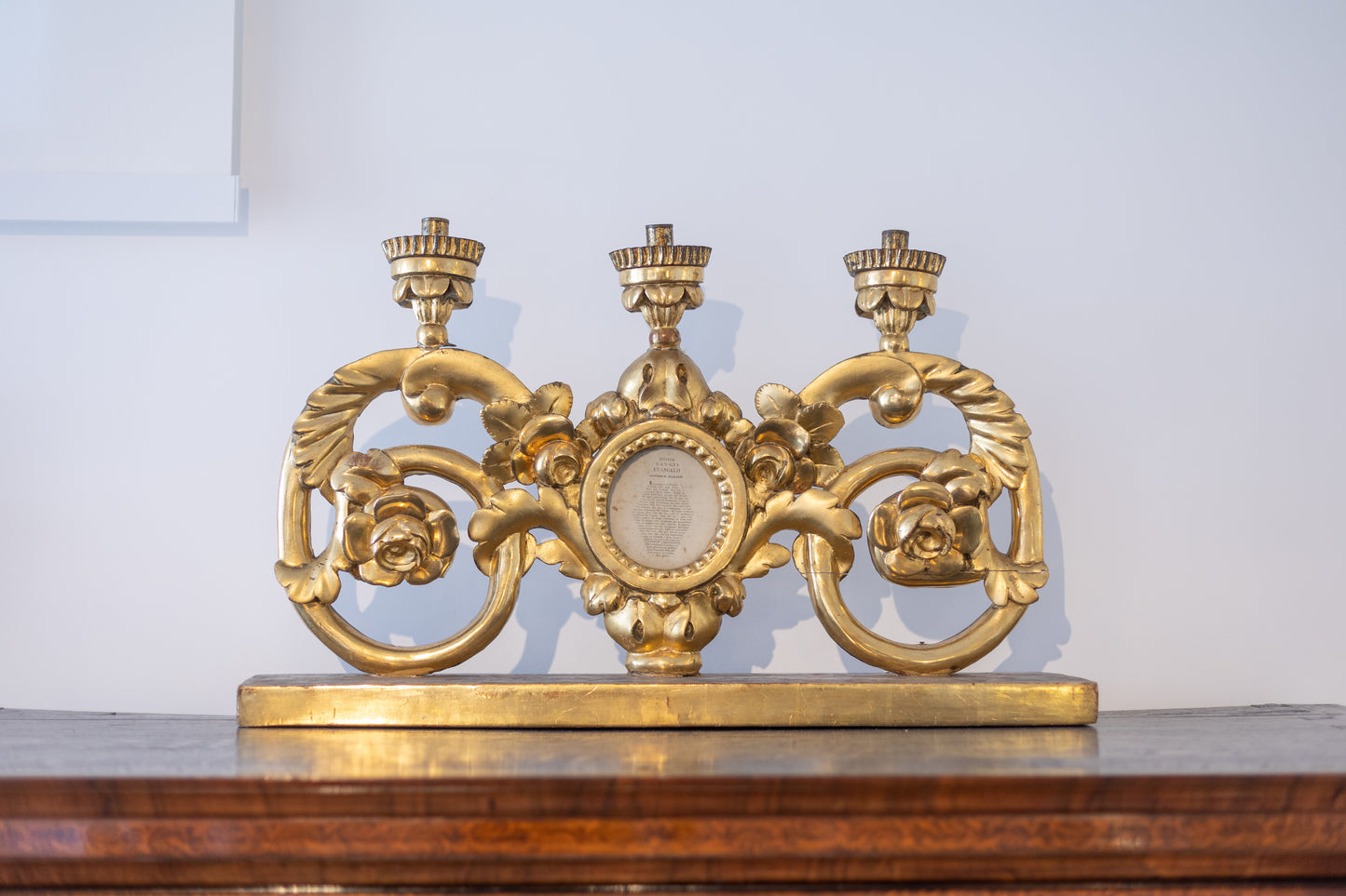 An attractive Maltese pair of 24ct gold painted and carved pine ecclesiastical (altar?) candelabra featuring sacred texts in a central glass roundel c.1800