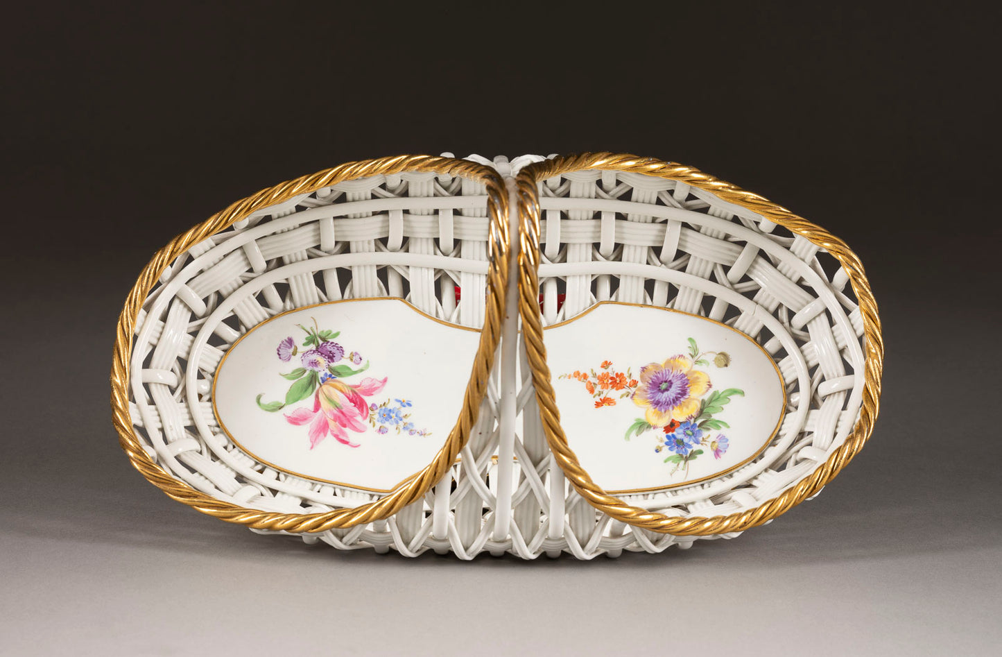 A gorgeous signed and numbered Meissen porcelain basket with hand painted floral design with gold staffage c.1900