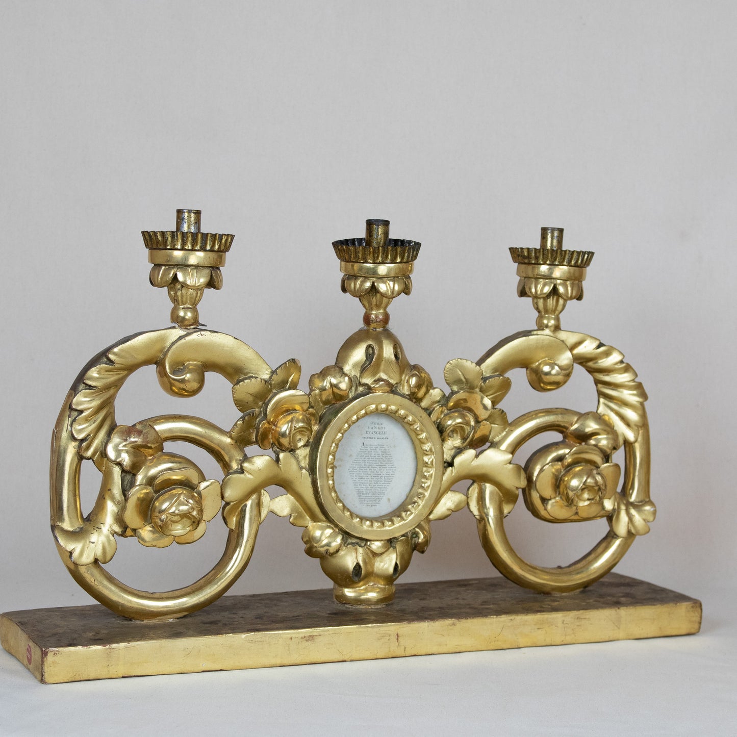 An attractive Maltese pair of 24ct gold painted and carved pine ecclesiastical (altar?) candelabra featuring sacred texts in a central glass roundel c.1800