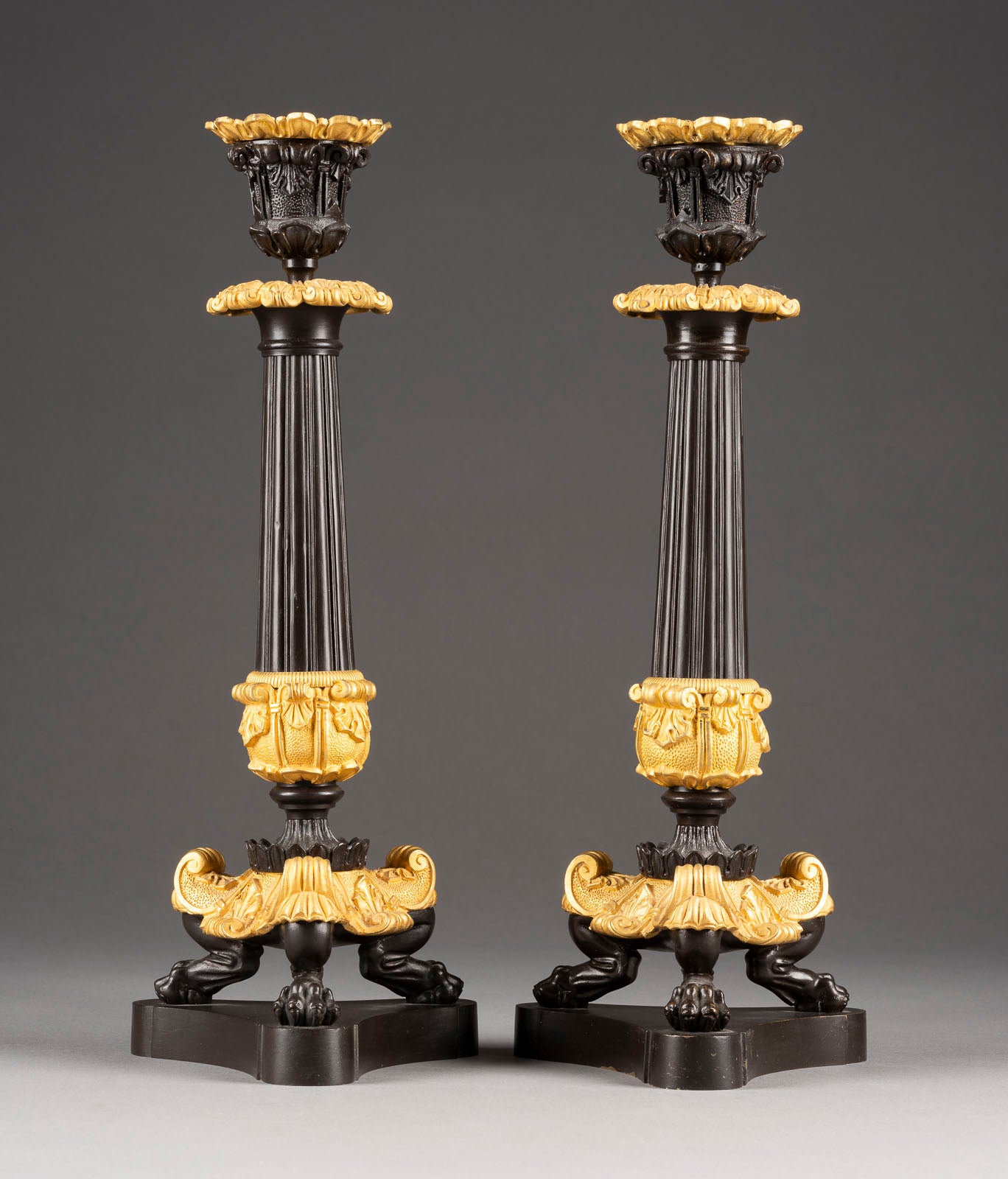 A Gorgeous pair of Napoleon III cast Candlesticks with dark patination and gold-plated bronze